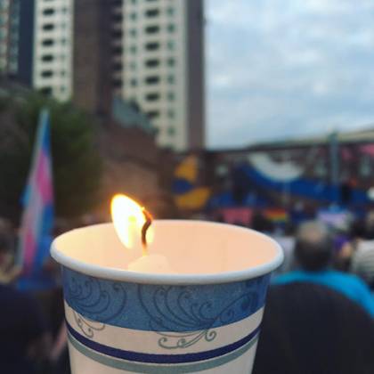 A candle in a paper cup at the Baltimore vigil for Orlando