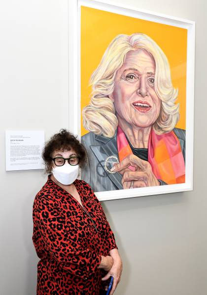 Artist Grace Graupe-Pillard stands next to her Edith Windsor portrait