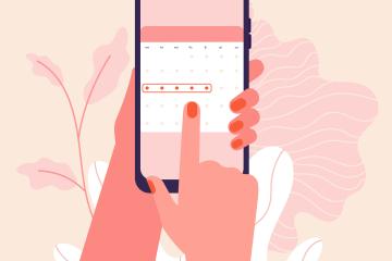 An illustration of a person holding a smart phone open to a period tracker app