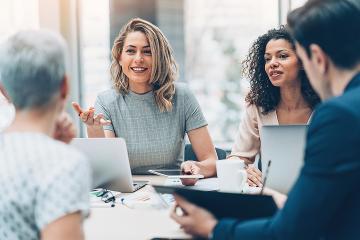 Female manager discussing business with colleagues