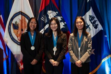 Hannah Yamagata, Delphine Tan, and Jenlu Pagnotta win the runner-up prize at the Collegiate Inventors Competition.