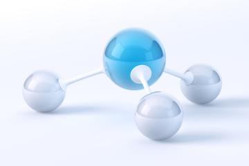 A central blue ball supported by three ball-feet representing the single nitrogen molecule and three hydrogen molecules that combine to create ammonia