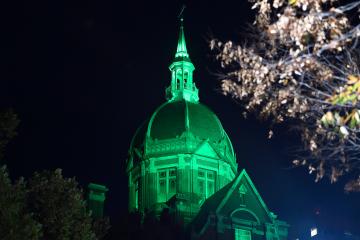 Hopkins Hospital dome bathed in green light