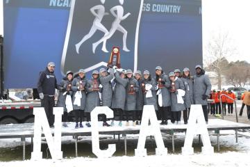 Johns Hopkins women's cross country team hoists NCAA championship trophy
