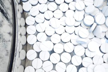 White pills in a manufacturing plant