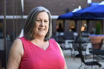 Amy Page relaxing in the Square, the Keswick campus's newly refurbished courtyard.