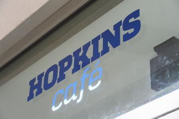 Closeup of a Hopkins Café sign