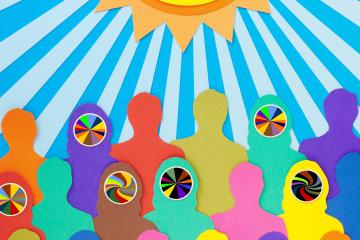 Paper illustration of multicolored crowd under the sun with a swirling patterns on some of their faces