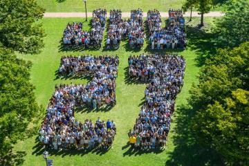 An aerial view of new Johns Hopkins students arranged to spell 
