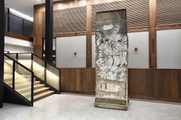 A fragment of the Berlin Wall has been installed at the Johns Hopkins University Bloomberg Center
