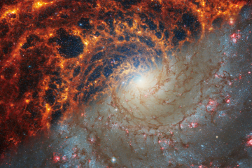  Two observations of a portion of the galaxy NGC 628 are split diagonally, with Webb’s observations at top left and Hubble’s at bottom right.