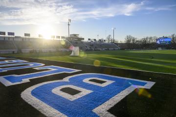 A lacrosse net stands on Homewood Field.