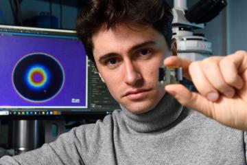 Johns Hopkins physics doctoral student Alvin Modin in the lab
