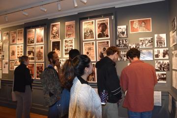 Museum goers look at the exhibit at The Peale