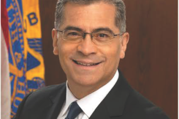 Government headshot of Xavier Becerra, an older Hispanic man with glasses