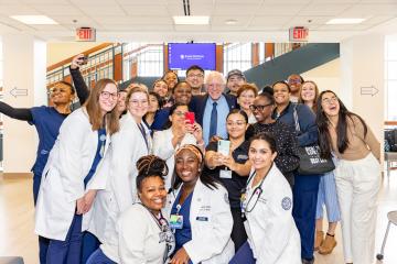U.S. Sen. Bernie Sanders poses for a photo with a large group of nursing students