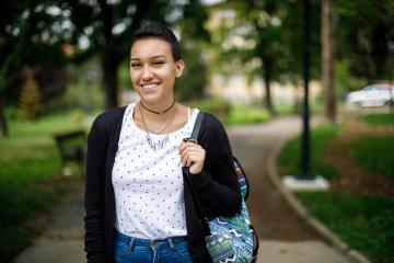 A smiling young woman on a college campus