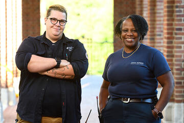 Electrician Tiiu Maiste and plumber Valerie Johnson on the Homewood campus, where they work on all nonhousing buildings.