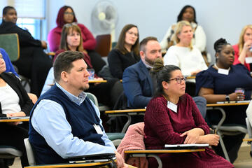 SAC members listen to President Daniels at their February orientation, at which they also heard from Laurent Heller and Meredith Stewart.