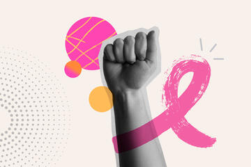 A breast cancer ribbon superimposed upon a raised fist