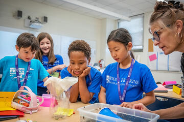 CTY students in last summer’s program at Gilman School in Baltimore conduct a water filtration experiment with their instructor.