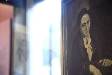 A print of Picasso's portrait of Gertrude Stein on display at Peabody Library