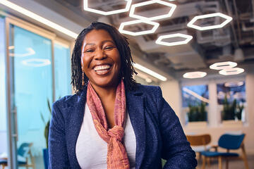 A woman laughs and smiles