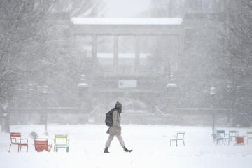 A student walks in the snow 