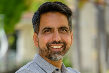 A professional headshot of Sal Khan.