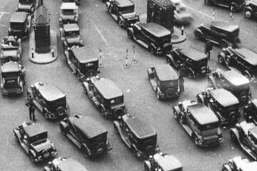 Detail of the cover of 'American Poison' shows early model American cars
