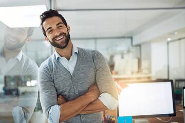 Happy-looking man in his office
