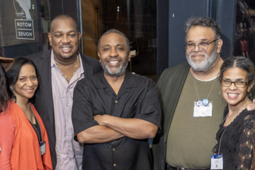 A photograph of a smiling group of Black Johns Hopkins alumni