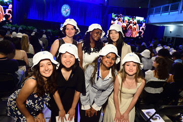 Students wearing bucket hats at convocation