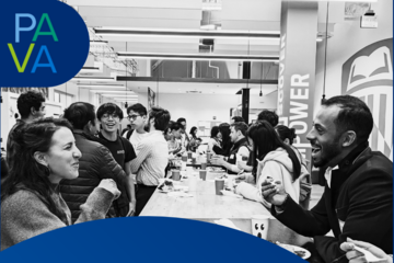 Black-and-white photo from Mix & Match Night with people engaging in conversation
