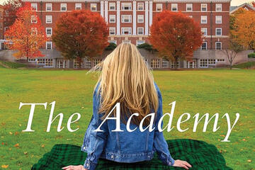 A girl sits on a blanket on the grass. In the distance is a large brick building and autumn trees. The words "The Academy" are superimposed over the image.
