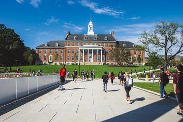 Students walk across a college campus