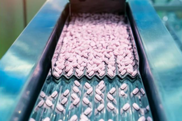 Photograph of pills in a manufacturing center