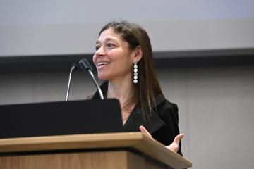 Jamie Spangler speaks at a podium.