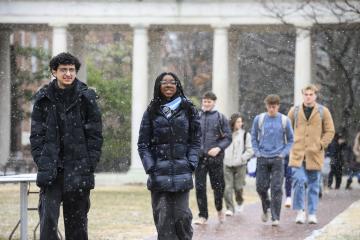 Students walk across the upper quad on the first snowy day of 2025