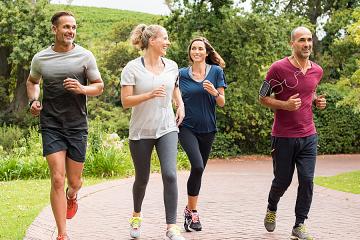 Two men and two women jogging