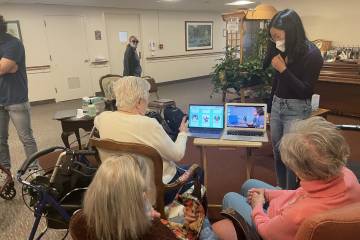 Retirement home residents test a prototype of an AI-powered game of 