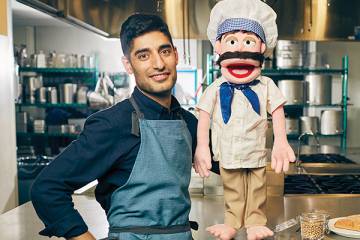Mohammad Modarres with a puppet chef
