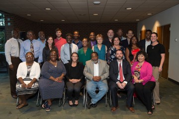 A group photo of the graduates and program leaders