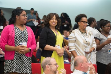 Julia Lynton-Brown (center) stands with her colleagues