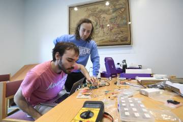 Jacob Young (front) and Collin Champagne troubleshoot their device