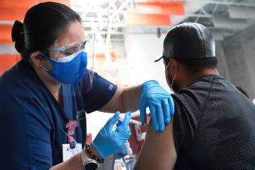 Residents visit the COVID-19 vaccination clinic at Henderson Hopkins