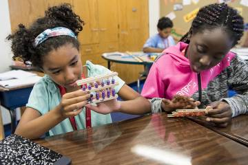 Students make an abacus during their Number Sense class at the CTY Baltimore Emerging Scholars Summer Program at Commodore John Rodgers Elementary/Middle School.