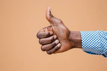 Closeup of hand giving a thumbs up