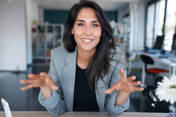 Confident woman talking with a colleage