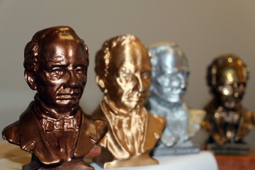 A closeup photo of a small bronze bust